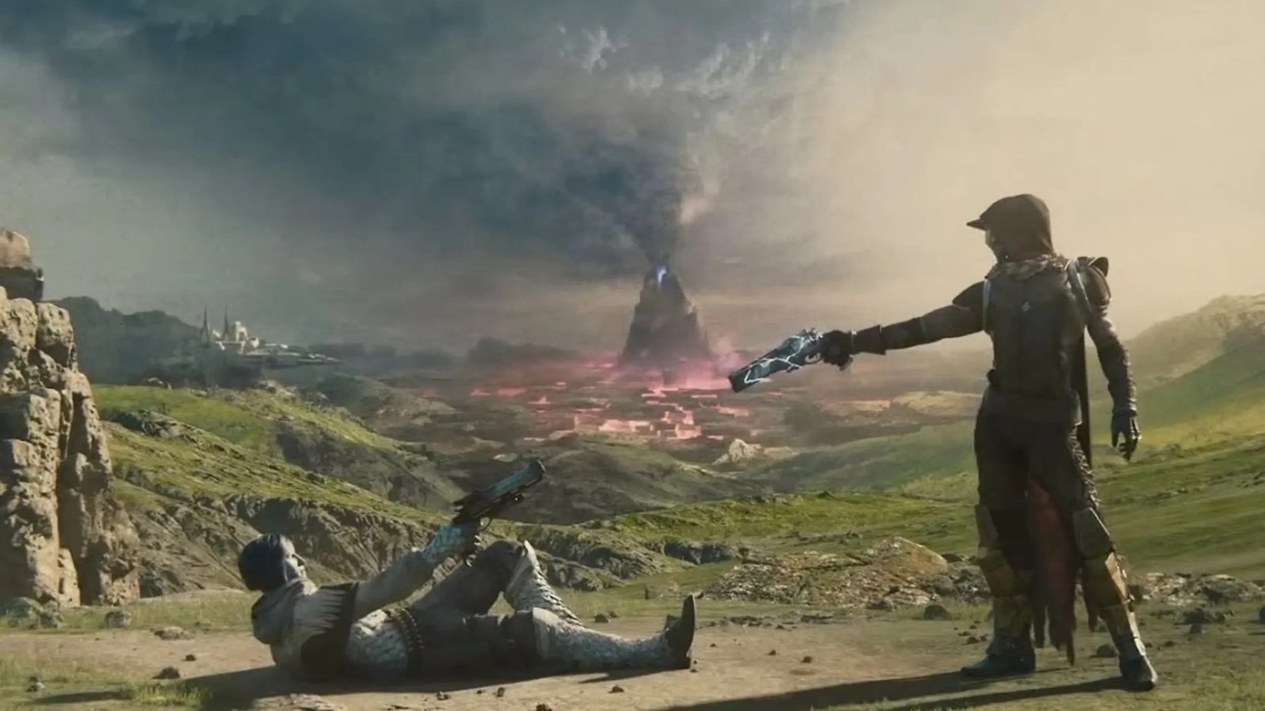 Divi Destiny 2 tēli stāv tuksnesīgā un kalnainā apvidū uz zaļas zāles fona. Viens tēls guļ uz muguras un tēmē ar revolveri uz otru tēlu, kurš stāv kājās un tēmē pretī, fonā redzams liels kalns ar maģisku liesmu dūmos.