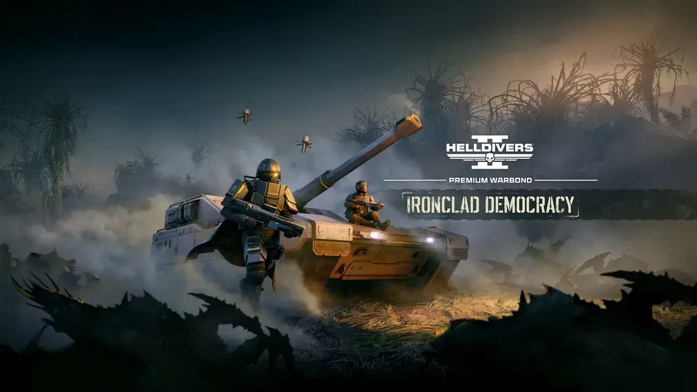 Spēles Helldivers 2 attēls, kurā redzami divi karavīri pie liela tanka dūmakainā vidē ar uzrakstu Ironclad Democracy
