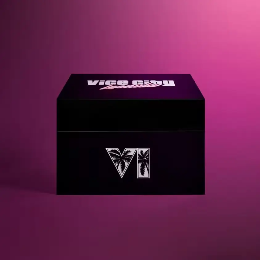 Melna GTA 6 Collector's Box kaste ar Vice City Leonida uzrakstu un romiešu ciparu VI ar palmu siluetiem uz violeti rozā fona