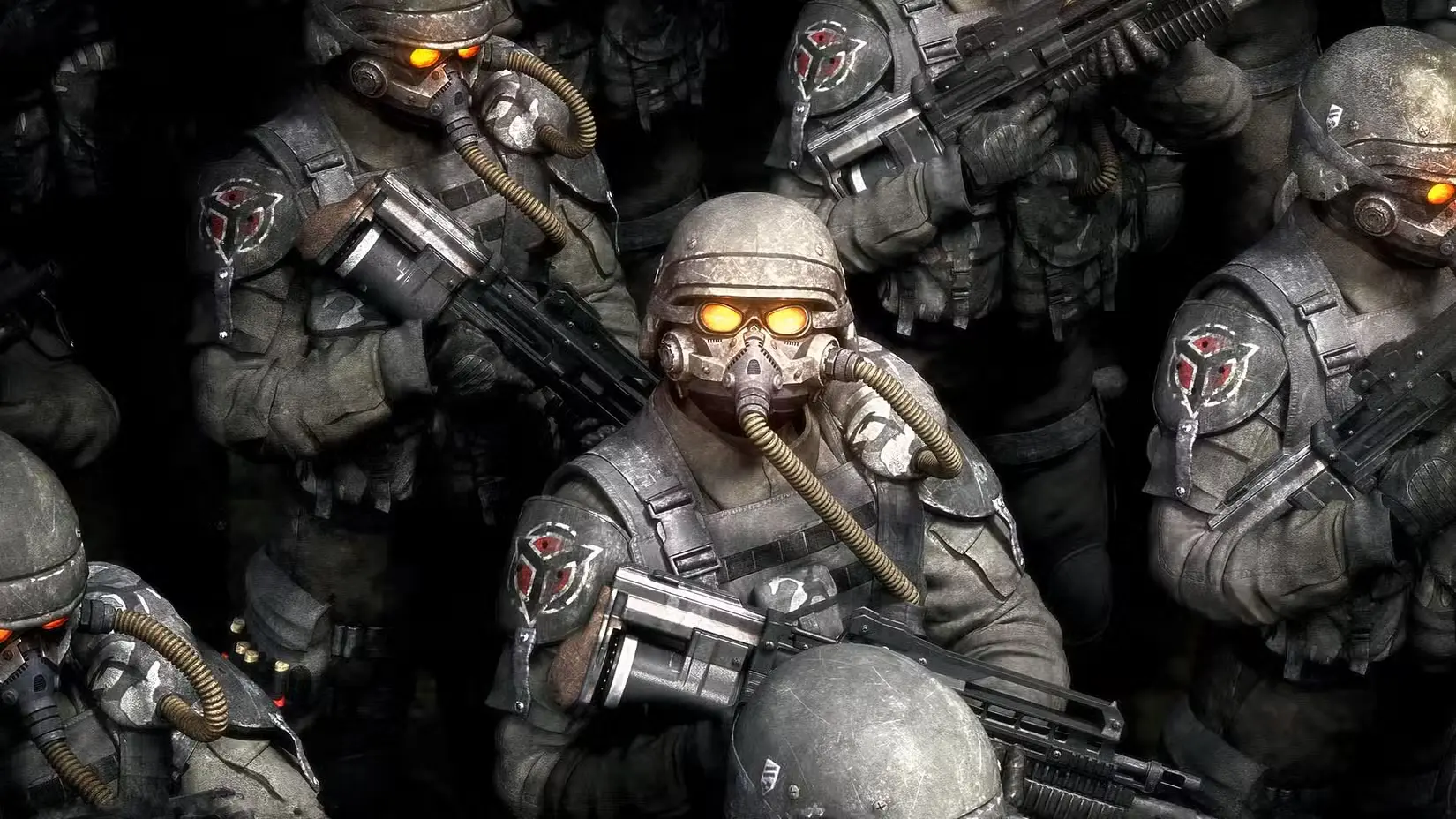 Grupa Helghast karavīru tumšos taktiskajos tērpos ar gāzmaskām un spīdošām dzelteni oranžām acīm, turot rokās futūristiskus ieročus